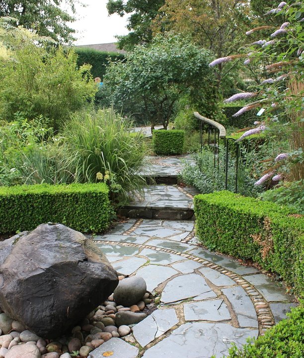 A patioed garden on a rainy day