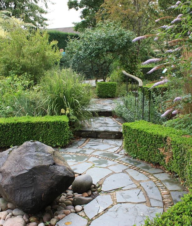 A patioed garden on a rainy day
